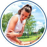 Woman with elbow pain from playing tennis.